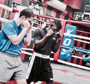 Two Boxers in Boxing Stance in the King of Strength Boxing Ring