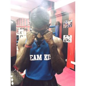 Coach Krishna in a boxing stance, ready for action.